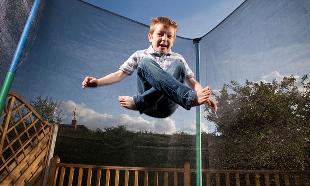 boy play on trampoline